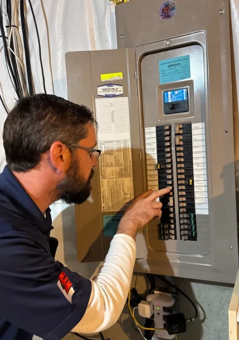 Electrician performing a 200 amp electrical panel upgrade in Greater Cincinnati